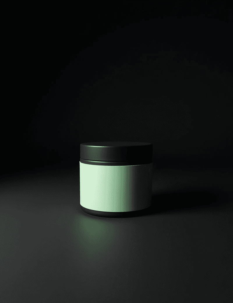 Matte black tin with pastel-green label in spotlight